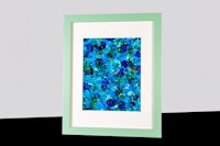 a framed painting of blue and green flowers on a white background